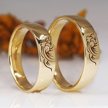 Eheringe V1678 in Gold oder Platin mit Wellenmuster-Diamant