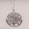 Medaglione dorato dellalbero della vita con diamanti blu pan074db